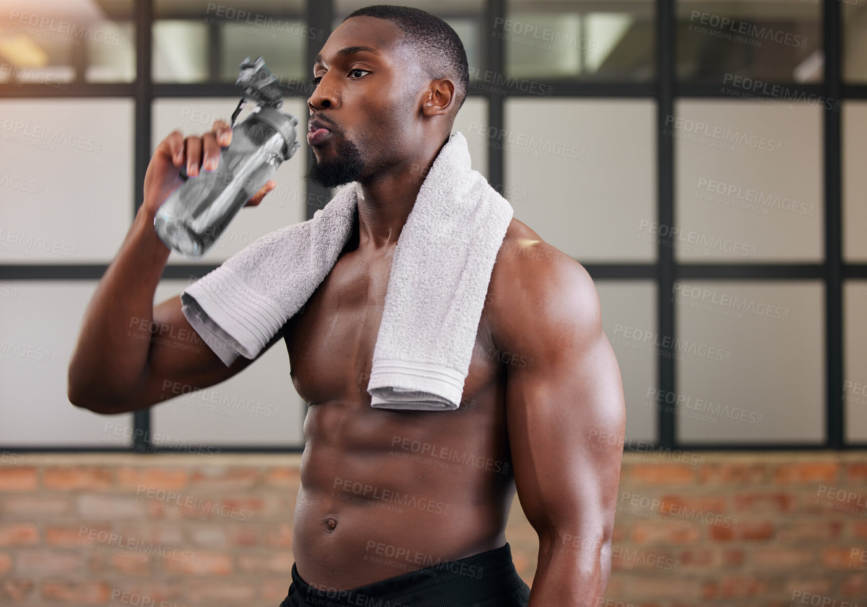 Buy stock photo Shirtless bodybuilder, black man and drinking water in gym for health, break and energy of workout, training or diet. Thirsty male, abs and bottle for fitness nutrition, hydration and sports wellness