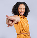 Hand, pointing and black woman in studio with you, choosing or decision against grey background. Happy, girl and finger emoji for direction, order or sign, symbol and gesture while posing isolated