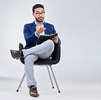 Questions, human resources and businessman with notebook for interview process in studio on grey background. Recruiter, asian male and recruitment process, negotiation and onboarding discussion