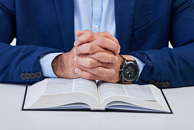 Buy stock photo Closeup, hands and man with bible, praying and guidance with higher power, hope and spiritual. Zoom, male and Christian with holy book, scripture and religious with faith, Catholic text and belief