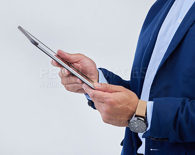 Buy stock photo Hands, tablet and man in studio closeup for communication, email or planning schedule by background. Businessman, mobile touchscreen and data analysis on web ux, tech and social network by backdrop