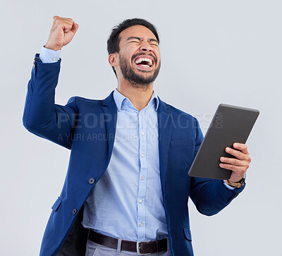 Buy stock photo Winner, excited and tablet with man in studio for good news, success and bonus. Pride, yes and celebration with male and cheering isolated on gray background for achievement, pride and job promotion 