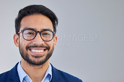 Buy stock photo Portrait, happy and excited businessman in studio with glasses, smile and confident on grey background space. Face, isolated and young mexican entrepreneur pose empowered, professional and handsome 