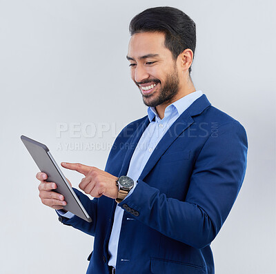 Buy stock photo Smile, tablet and asian businessman in studio reading email, networking and internet on white background. Connect, online report and man in suit, communication and technology for investor at startup.