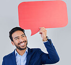 Smile, speech bubble and happy businessman in studio with mockup for social media, advertising or space. Blank, poster and asian guy with billboard for news, announcement or brand on grey background
