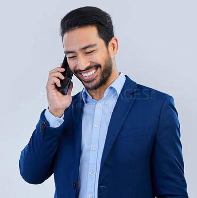 Buy stock photo Smile, phone call and asian businessman in studio, talking and networking on white background. Smartphone, conversation and man in suit, communication and technology for investor trading at startup.