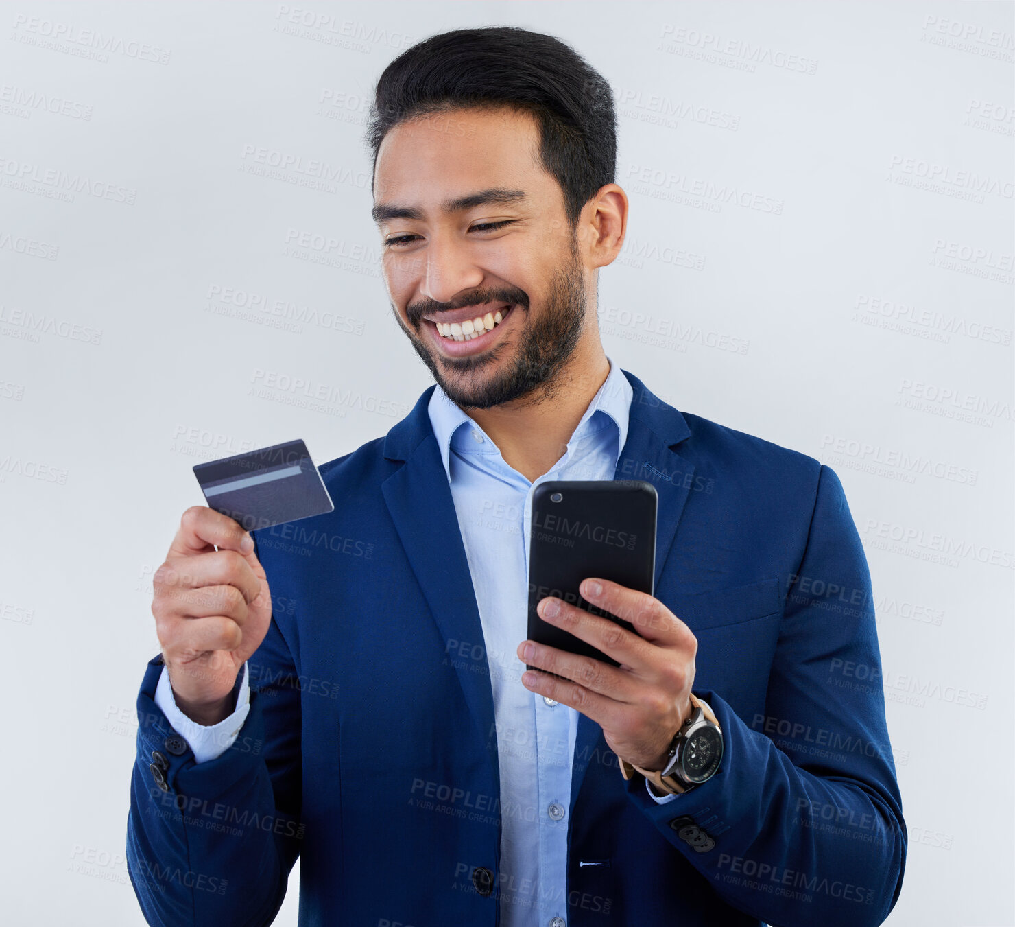 Buy stock photo Credit card, phone and smile with man in studio for online shopping, fintech and investment. Banking, ecommerce and app with male on gray background for customer experience, payment and retail