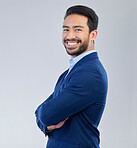 Business man, arms crossed and smile portrait in studio for corporate or CEO fashion while happy. Face of asian entrepreneur person on isolated white background with pride for career and success