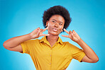 Happy, motivation and black woman with peace sign, inspiration and success against blue studio background. African American female, lady and hand gesture for emoji, silly and v symbol with happiness