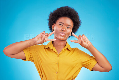 Buy stock photo Happy, motivation and black woman with peace sign, inspiration and success against blue studio background. African American female, lady and hand gesture for emoji, silly and v symbol with happiness