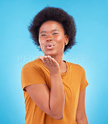 Buy stock photo Portrait, black woman and blowing kiss on blue background of love, care and flirting in studio, color backdrop and face. Happy female model, hand kisses and emotion of happiness, fun or kissing emoji