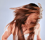 Hair movement, model and balayage of woman with beauty and hairstyle texture in a studio. Cosmetics, shampoo treatment and keratin of a female with healthy, clean and haircare shine from salon