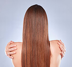 Healthy hair, model and back of a woman with beauty, wellness and soft hairstyle texture in a studio. Shampoo treatment and keratin of a female with balayage, clean and haircare aesthetic from salon