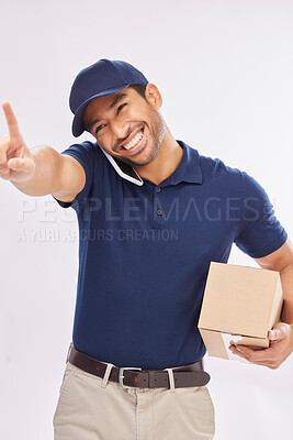 Buy stock photo Phone call, delivery smile and Asian man with box in studio isolated on a white background. Shipping, logistics and happy male courier with package and cellphone for ecommerce, talking or chatting