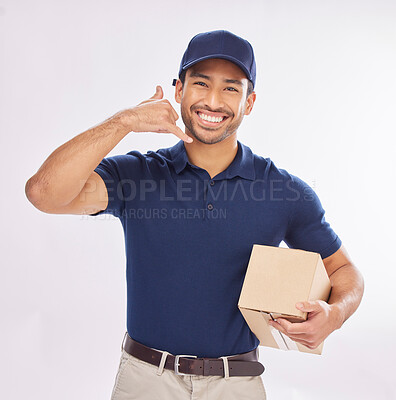 Buy stock photo Call me, delivery man and courier with phone gesture an happy to deliver package as ecommerce in studio white background. Shipping, excited and employee or person with parcel using cellphone sign