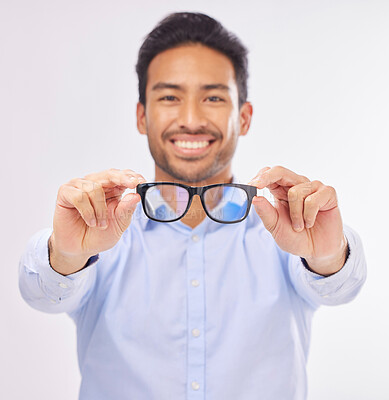 Buy stock photo Glasses, happy man portrait and studio with a optometrist showing an eye wear product. Smile, happiness and frame choice sale of a male model with lens check and optometry with blurred background