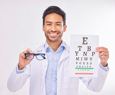 Buy stock photo Portrait of doctor holding glasses, eye test and smile at vision clinic, reading assessment and eyesight in India. Healthcare, wellness and happy man optometrist with medical exam for eyes and sight.