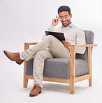 Chair, clipboard and man reading isolated on a white background therapist notes, checklist and expert review. Asian professional person or psychologist relax on armchair with career folder in studio