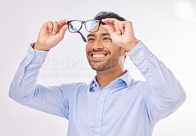 Buy stock photo Glasses, vision and man happy in studio for eye care, lens or frame isolated on a white background. Smile of excited asian male model face with optometry eyewear in hands to check eyesight or focus