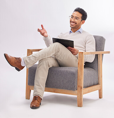 Buy stock photo Asian man, therapist and chair with clipboard in session isolated against a white studio background. Happy male psychologist or consultant in therapy, counseling or mental health solution on mockup