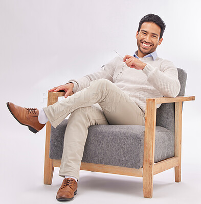 Buy stock photo Relax, chair and portrait of business man sitting happy with a smile and crossed legs isolated in studio white background. Gentleman, confident and professional or proud male employee or entrepreneur