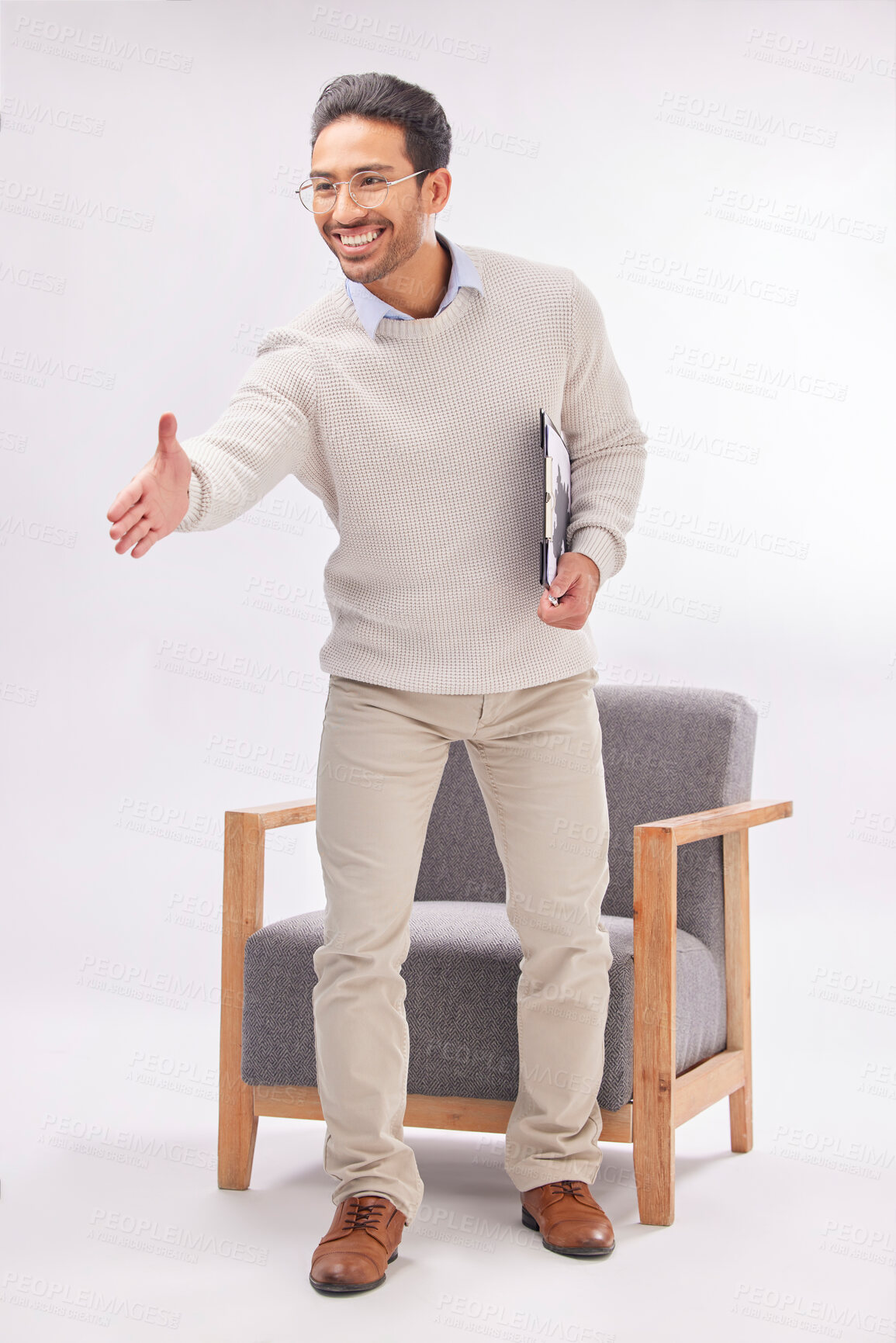 Buy stock photo Handshake offer of professional man isolated on a white background, welcome meeting or psychologist client hello. Asian person or therapist shake hands in deal or introduction with armchair in studio