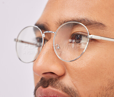 Buy stock photo Zoom, optometry and face of a man with glasses for vision, intelligence and eyecare. Looking, serious and guy wearing fashionable eyeglasses, showing frame and fit isolated on a studio background