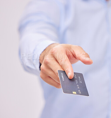 Buy stock photo Credit card in hand, payment and shopping with man, purchase product or service isolated on white background. Closeup, commerce and customer, buying with promotion and sale, shop and male in studio