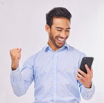 Winner, celebration and business man with phone in studio isolated on a white background. Success, cellphone and happy male professional celebrating, bonus or winning prize, competition or lottery.