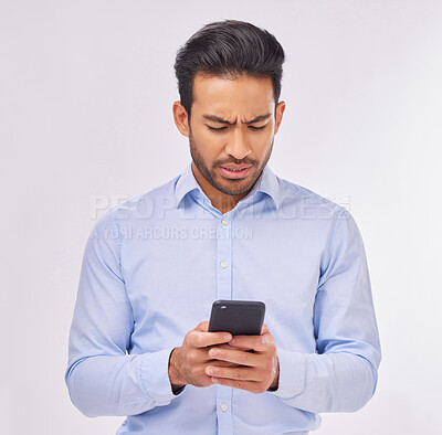 Buy stock photo Angry, phone and business man typing in studio isolated on white background. Cellphone, confused or upset male professional with smartphone for reading fake news, social media or glitch, error or 404