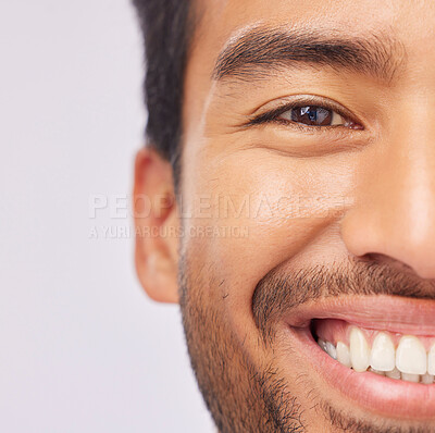 Buy stock photo Half, face and teeth of a man with dental, oral and mouth hygiene isolated against a studio white background. Smile, clean and whitening treatment for a happy male feeling excited and confident