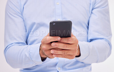 Buy stock photo Business man, hands and typing with phone in studio isolated on a white background. Cellphone, networking and male professional with smartphone for texting, social media or internet browsing online.