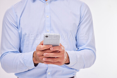 Buy stock photo Hands, business man and typing with phone in studio isolated on a white background. Cellphone, networking and male professional with smartphone for texting, social media or internet browsing online