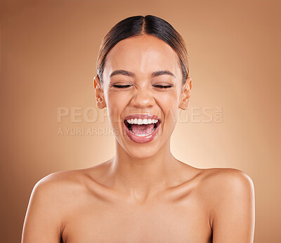 Buy stock photo Beauty, face and a woman laughing in studio for skincare with dermatology, cosmetics or makeup. Happy aesthetic female model on a brown background for self care, skin glow and facial wellness