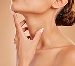 Skincare, beauty and body of a woman with a glow isolated on a brown background in a studio. Wellness, cosmetic and a girl feeling and touching skin for cosmetics, grooming and care for anti aging