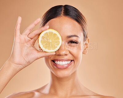 Buy stock photo Skincare, lemon and face of woman with smile in studio for wellness, facial treatment and natural cosmetics. Beauty, dermatology spa and happy girl with citrus fruit for detox, vitamin c and health