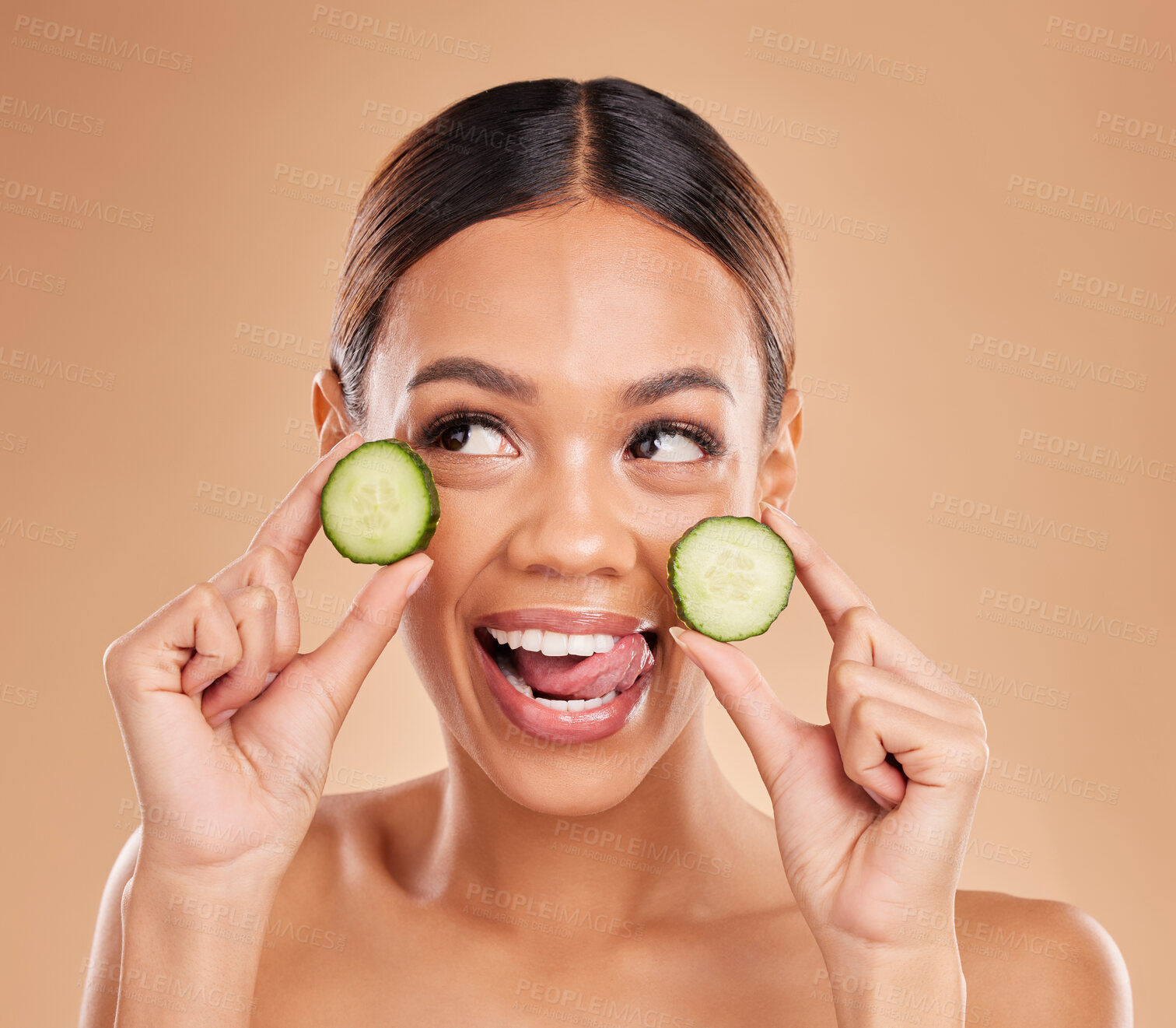 Buy stock photo Skincare, holding cucumber and face of woman with smile for wellness, facial treatment and natural cosmetics. Beauty, spa aesthetic and happy girl with fruit for detox, vitamin c and health in studio