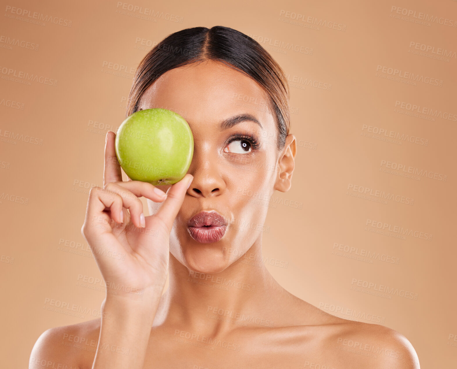 Buy stock photo Beauty, skincare or woman with apple in studio on beige background for healthy nutrition or clean diet. Eye, hand or girl model advertising or marketing natural fruits for nutrition or wellness 