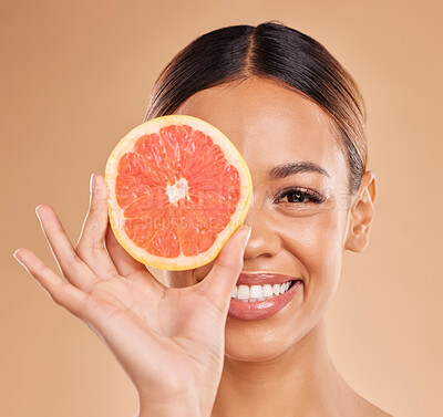 Buy stock photo Skincare, grapefruit and portrait of woman with smile in studio for wellness, facial treatment and natural cosmetics. Beauty, spa and happy girl with fruit slice for detox, vitamin c and dermatology