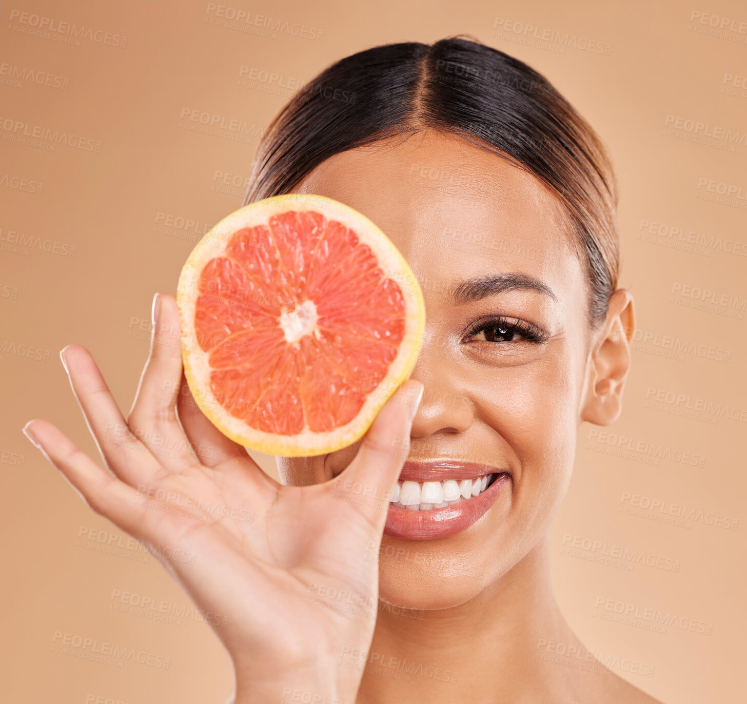 Buy stock photo Skincare, grapefruit and portrait of woman with smile in studio for wellness, facial treatment and natural cosmetics. Beauty, spa and happy girl with fruit slice for detox, vitamin c and dermatology