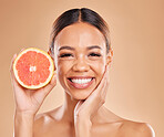 Skincare, grapefruit and face of woman with smile in studio for wellness, facial treatment and natural cosmetics. Beauty, spa aesthetic and happy girl with fruit for detox, vitamin c and healthy skin