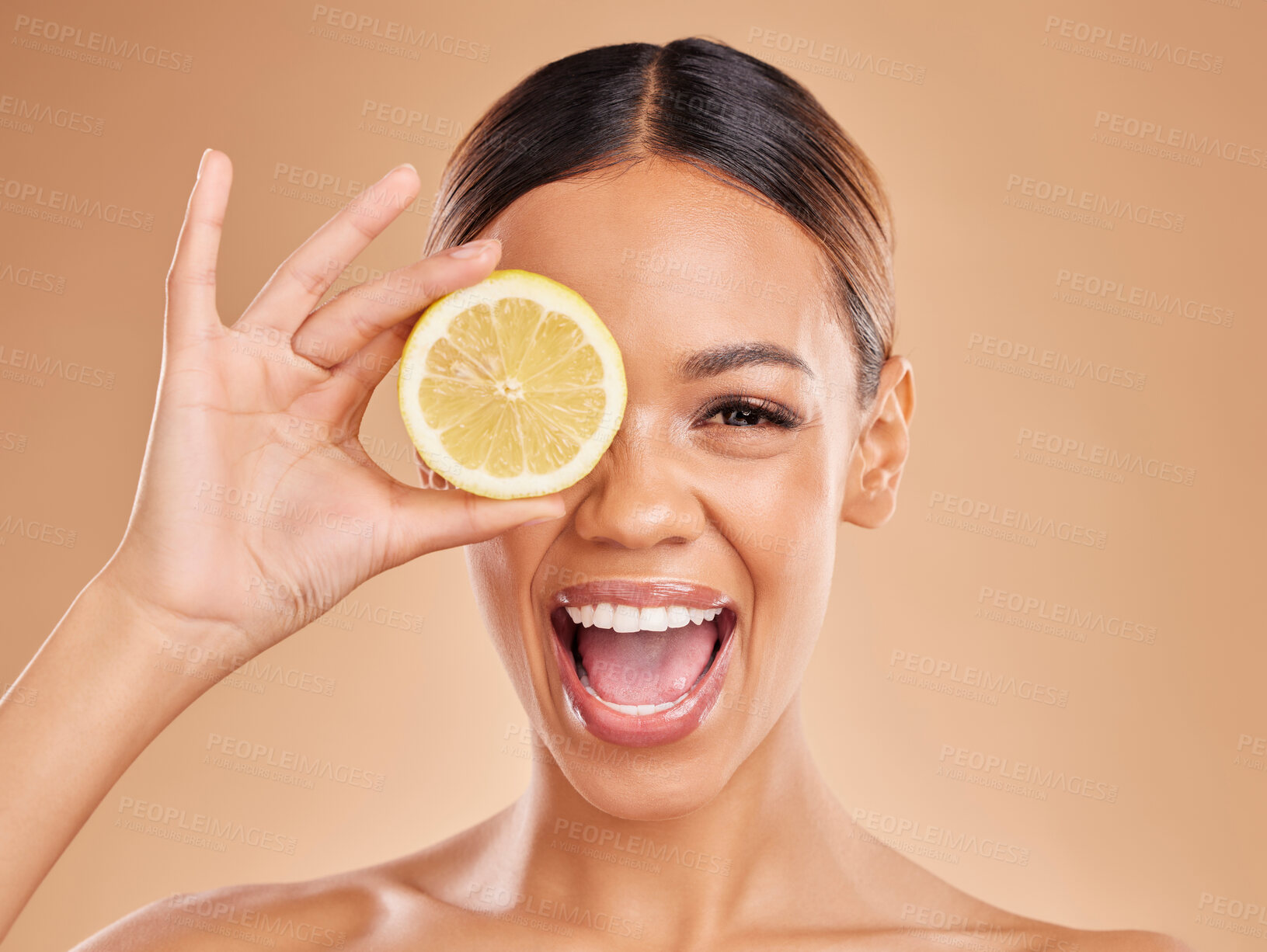 Buy stock photo Lemon, skincare and face of woman with excited smile in studio for wellness, facial treatment and natural cosmetics. Beauty, spa and happy girl with fruit slice for detox, vitamin c and dermatology