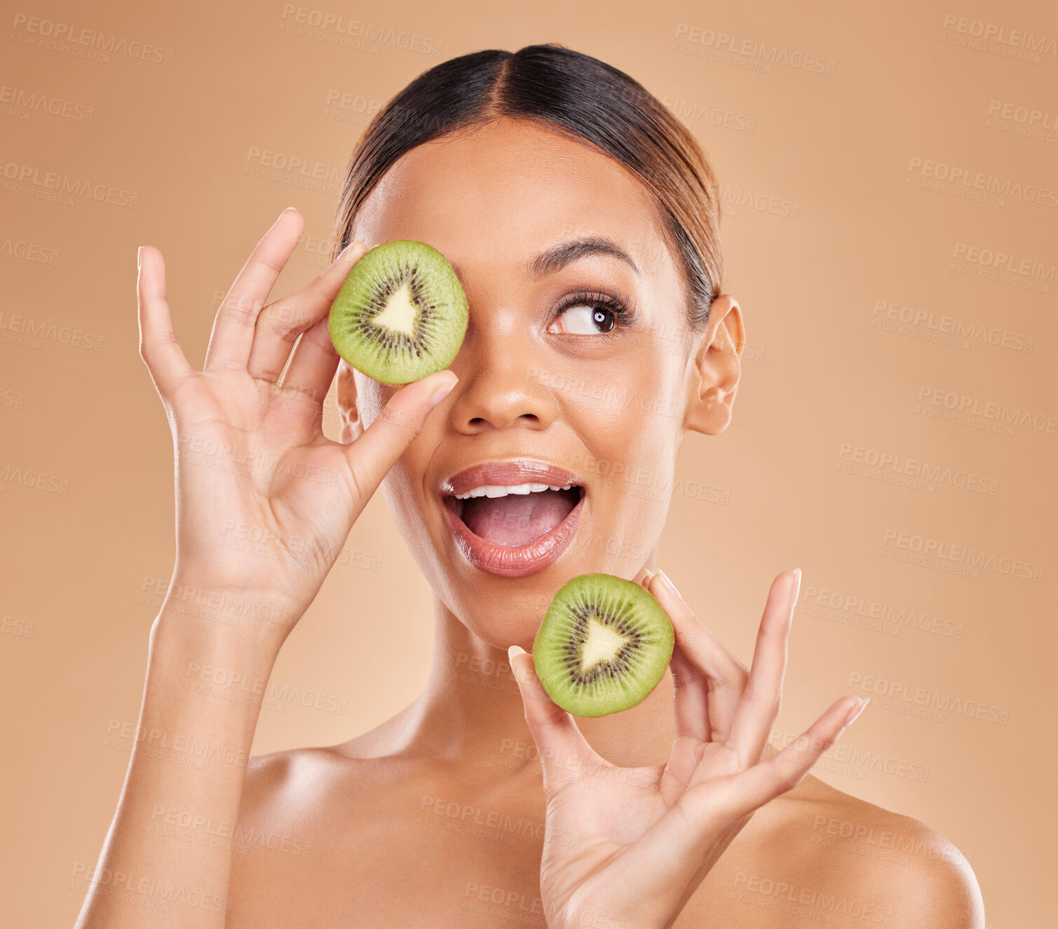 Buy stock photo Kiwi, skincare and face of woman in studio for organic wellness, facial treatment and natural cosmetics. Beauty, spa aesthetic and happy girl smile with fruit for detox, dermatology and healthy skin