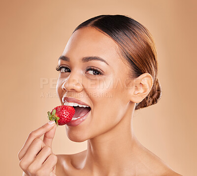 Buy stock photo Skincare portrait, eating or woman with strawberry in studio on beige background for healthy nutrition or clean diet. Healthcare, face or beautiful girl model or marketing natural fruits for wellness