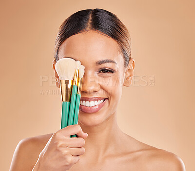 Buy stock photo Makeup brushes, portrait or happy woman with eyeshadow, facial products or self care on studio background. Face model, smile or young girl smiling with beauty cosmetics or natural glowing skincare 