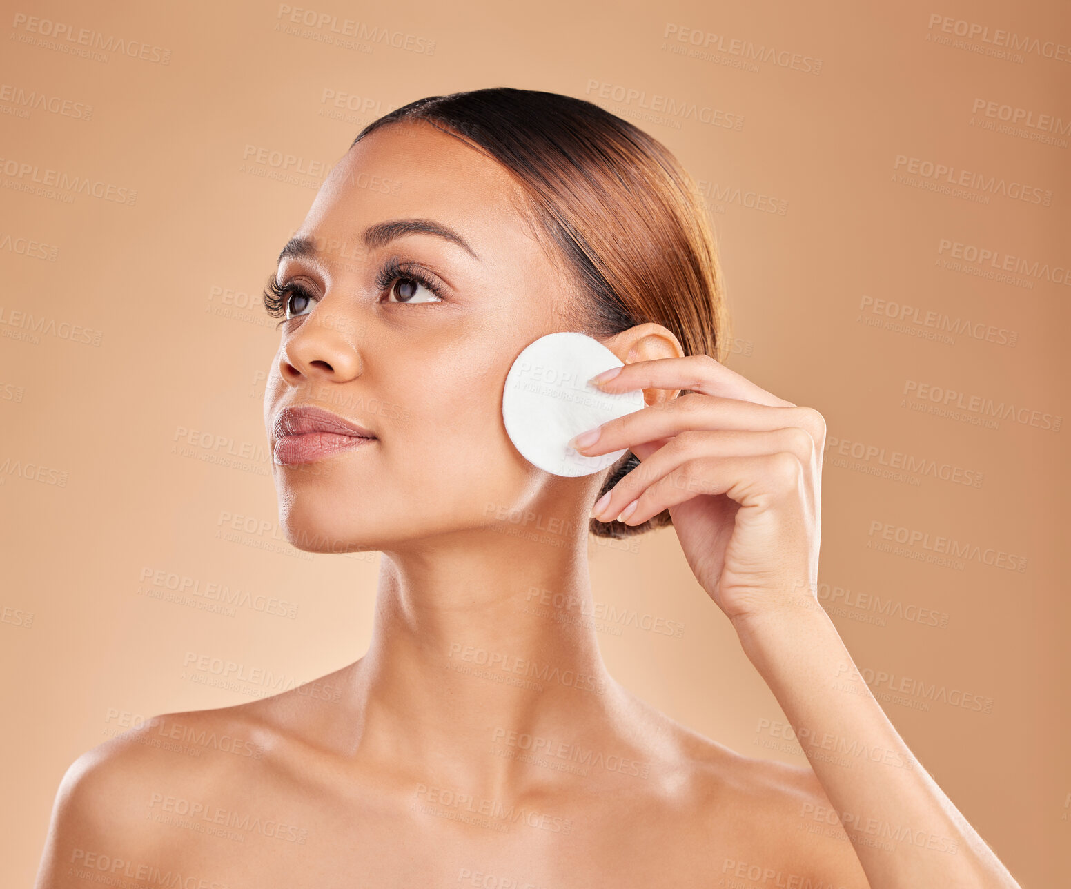 Buy stock photo Beauty, cotton and cleaning face of woman in studio with dermatology, cosmetic and detox. Aesthetic model with hands for natural facial makeup clean, self care and skincare for glow or wellness
