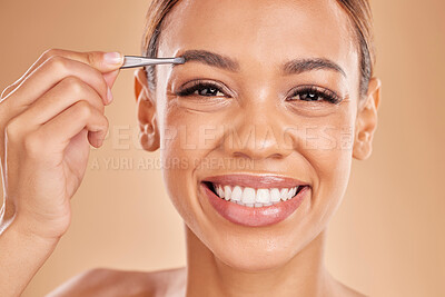 Buy stock photo Woman, face and tweezer on eyebrow for skincare beauty, grooming or trimming against a studio background. Portrait of happy female tweezing eyebrows with big smile for facial cleaning or hair removal