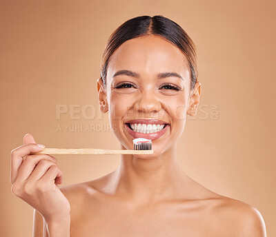 Buy stock photo Portrait, toothpaste or woman brushing teeth with product for healthy oral or dental hygiene in studio. Face, smile beauty or happy girl model cleaning mouth with a natural bamboo wooden toothbrush 
