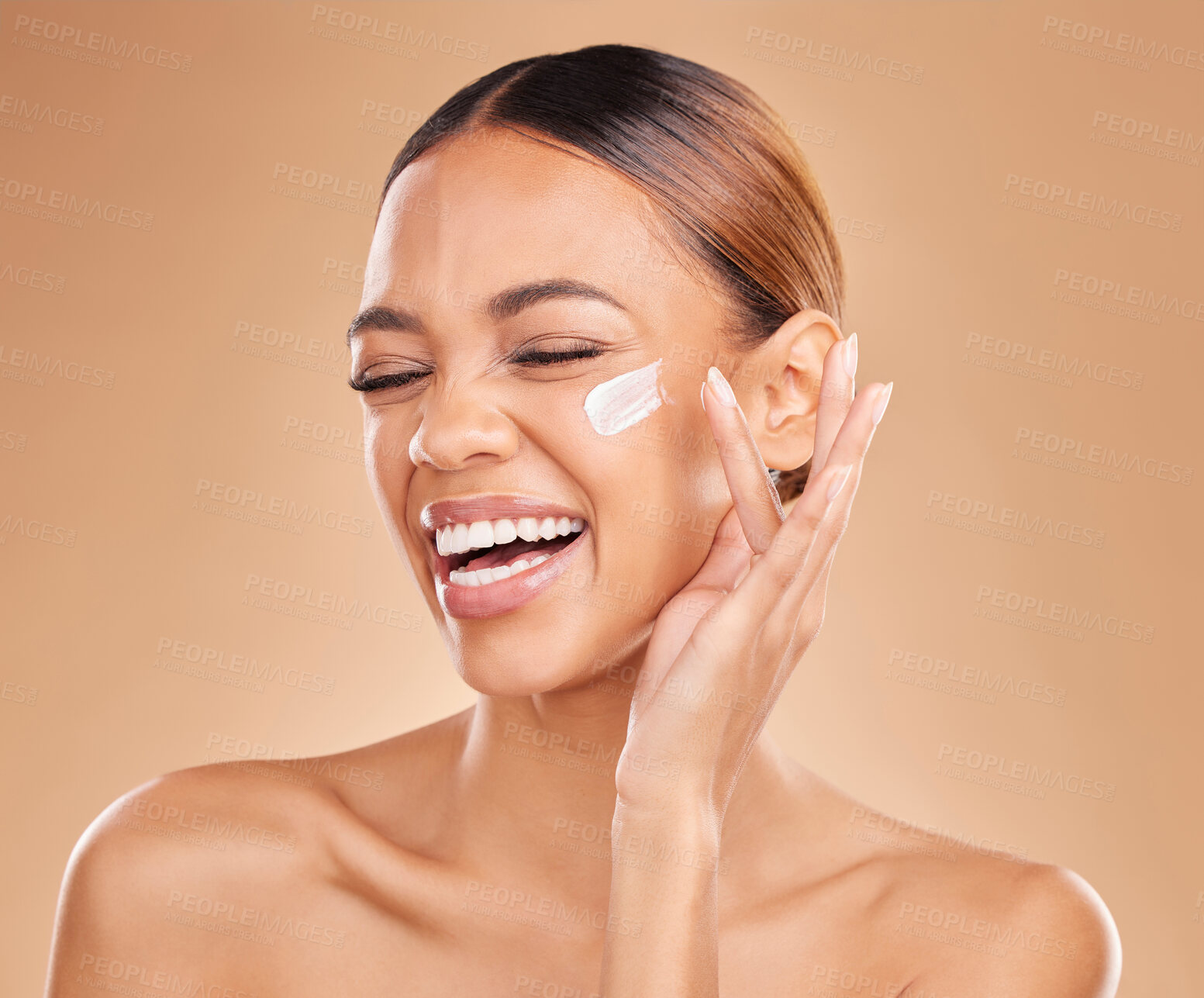 Buy stock photo Face skincare, funny and woman with cream in studio isolated on a brown background. Laughing, beauty cosmetics and happy female model apply lotion, creme or facial moisturizer product for skin health