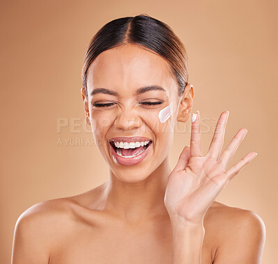 Buy stock photo Woman, skincare cream and smile in studio for beauty, wellness and excited face by background. Girl, young model and laugh with cosmetic skin product for natural glow, collagen or dermatology benefit